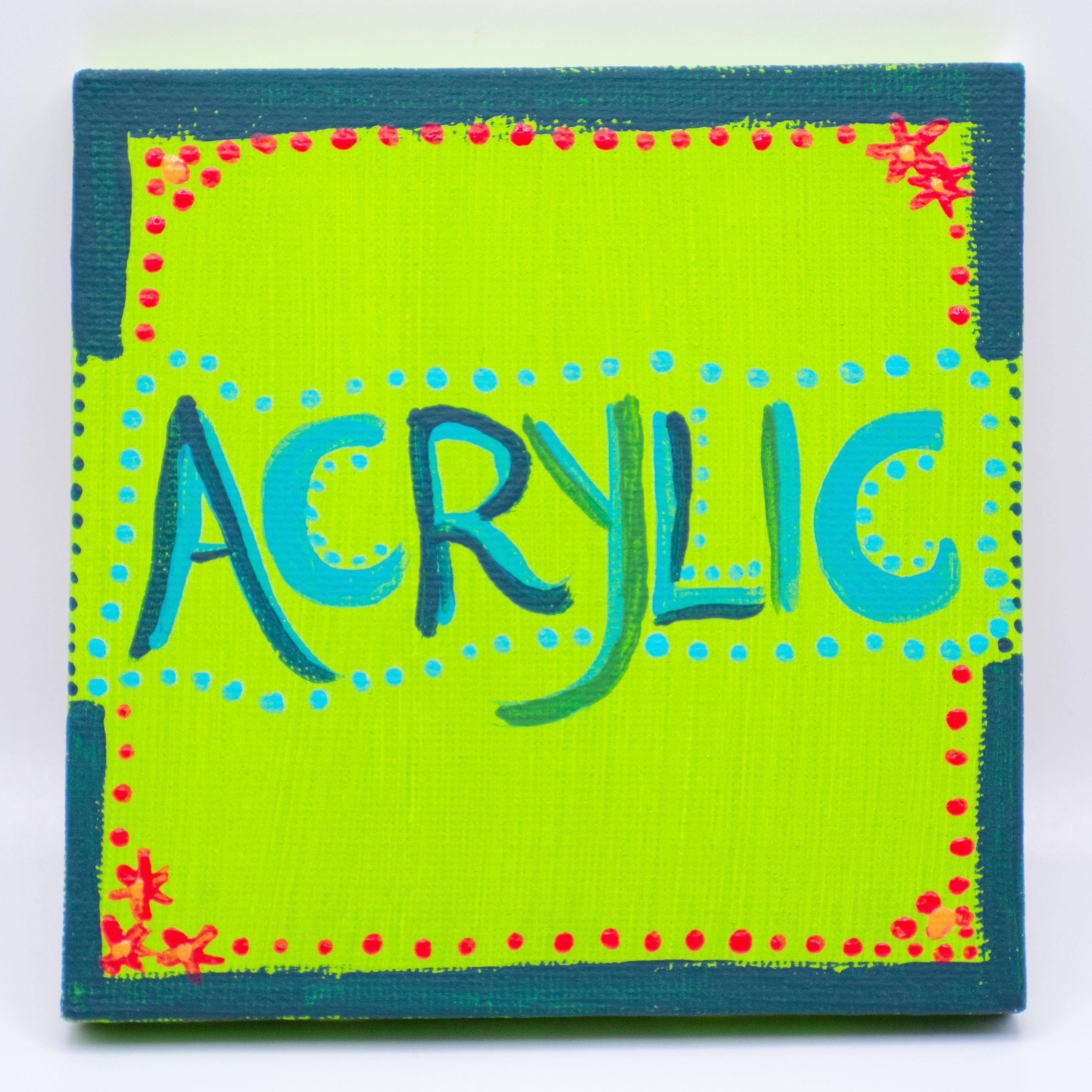 the word acrylic painted on a small canvas
